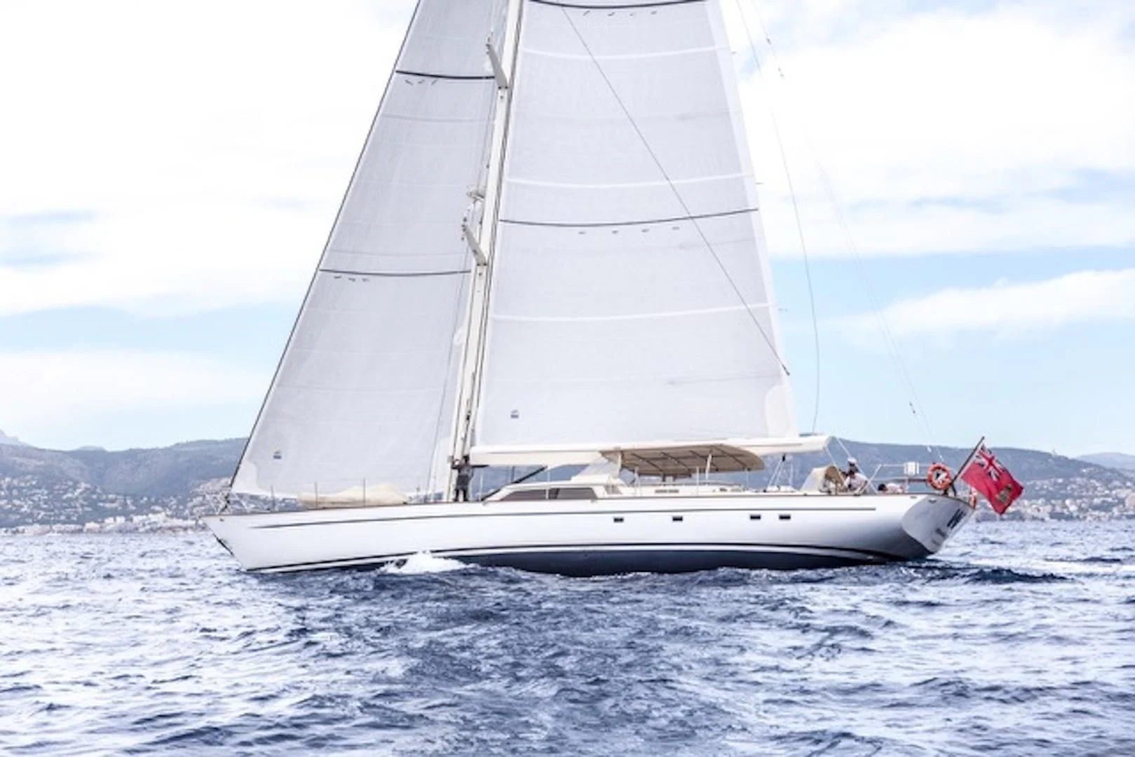a white sailboat on the water aboard WAVELENGTH Yacht for Sale