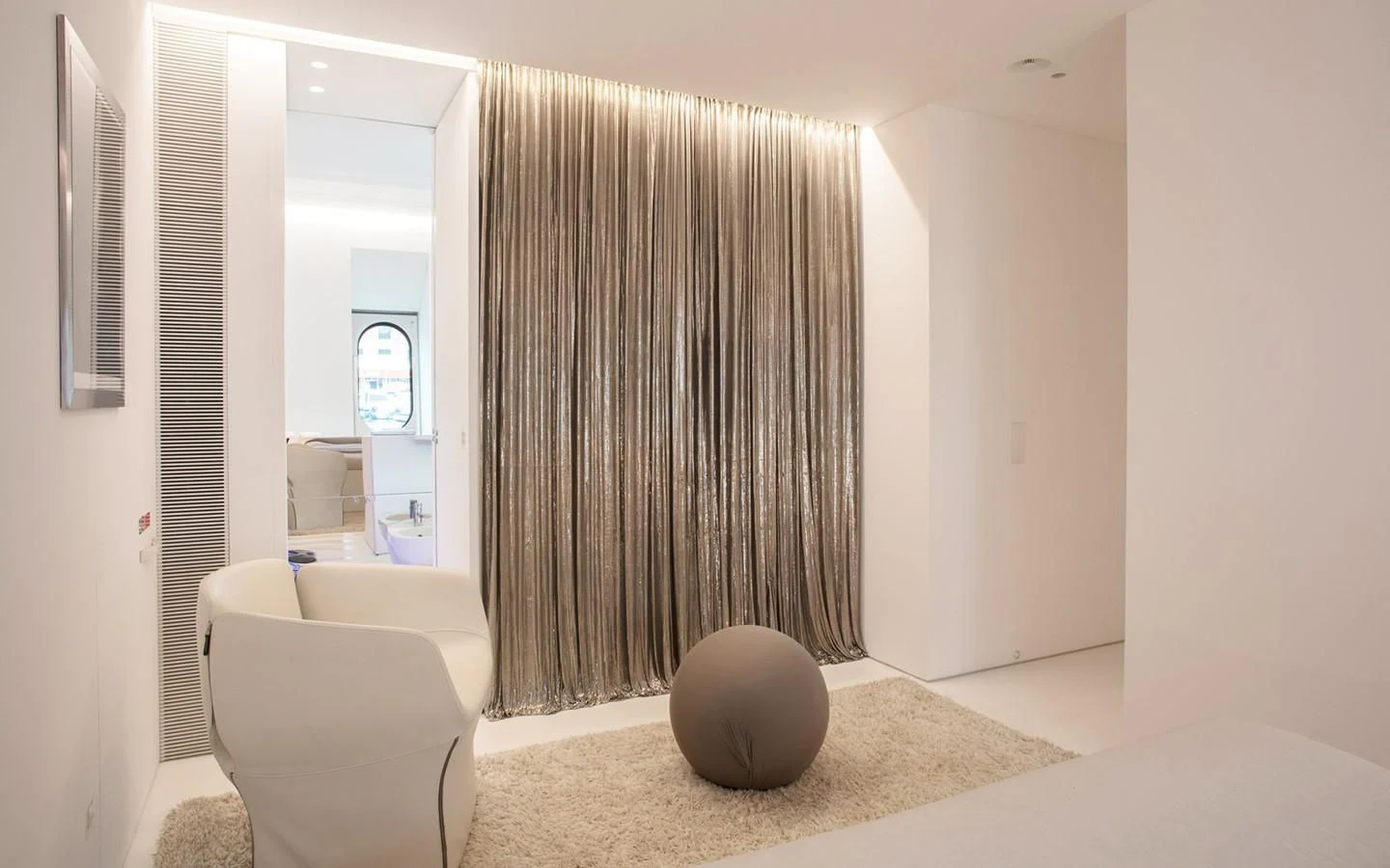 a room with a ball and a curtain aboard FLYING DAGGER Yacht for Sale