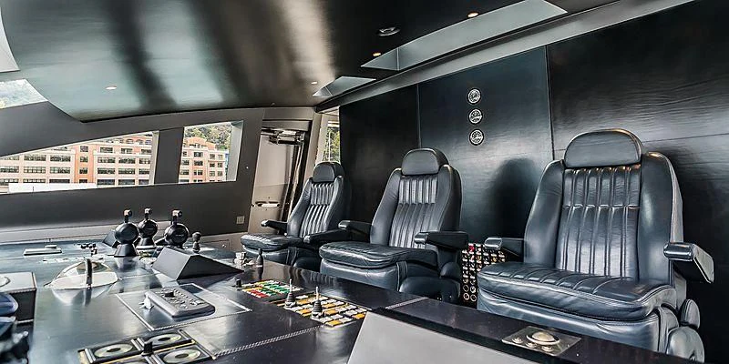 a room with a table chairs and a window aboard FLYING DAGGER Yacht for Sale