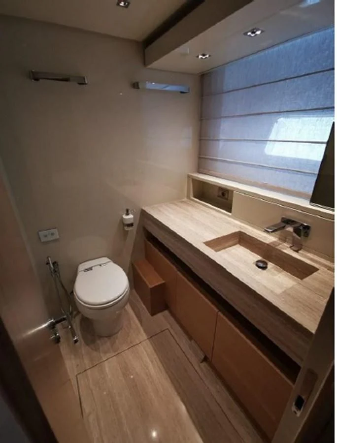 a bathroom with a toilet and a sink aboard Y2 Yacht for Sale