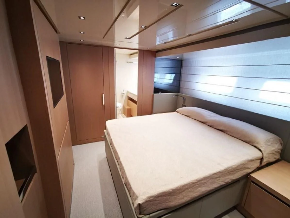 a room with a bed and a window aboard Y2 Yacht for Sale