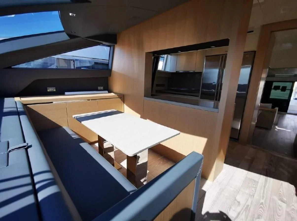 a room with a table and chairs aboard Y2 Yacht for Sale