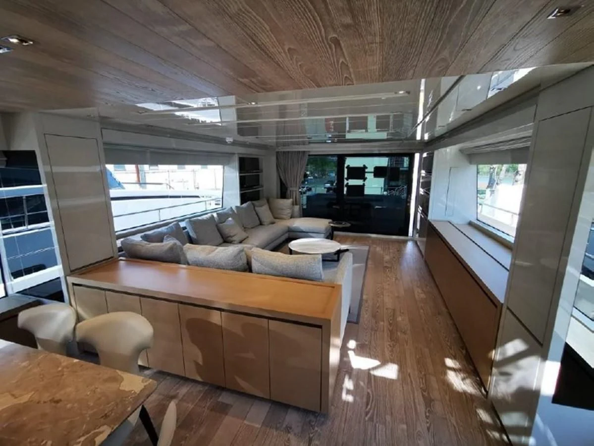 a living room with a wood floor aboard Y2 Yacht for Sale