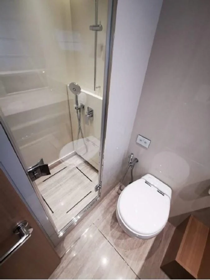 a bathroom with a glass shower aboard Y2 Yacht for Sale