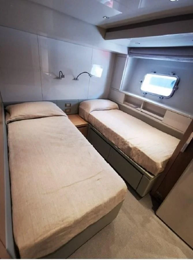 a couple of beds in a room aboard Y2 Yacht for Sale
