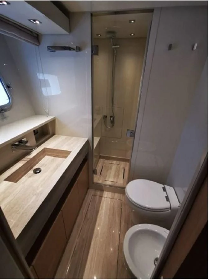 a bathroom with a shower and toilet aboard Y2 Yacht for Sale