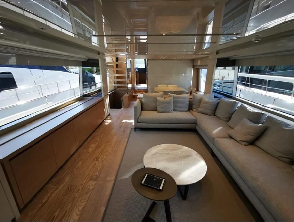 a living room with a large window aboard Y2 Yacht for Sale