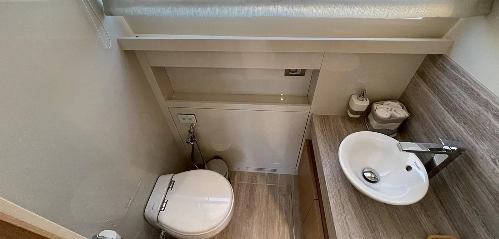 a bathroom with a toilet and sink aboard Y2 Yacht for Sale