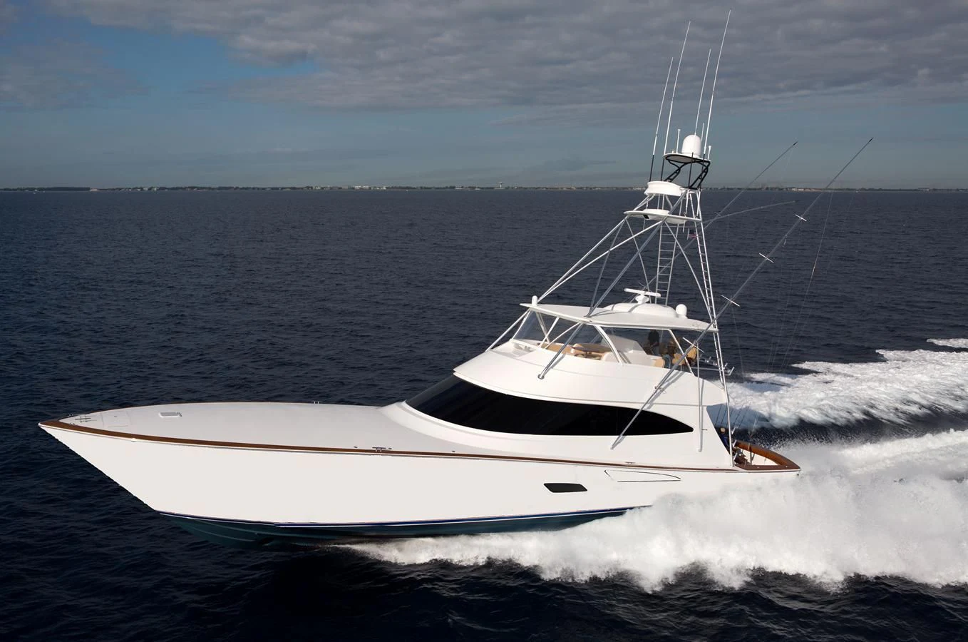 a white boat on the water aboard 80'VIKING 2018 Yacht for Sale