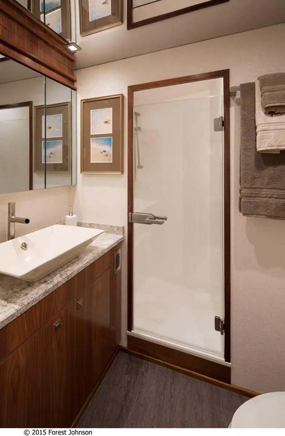 a bathroom with a white door aboard 80'VIKING 2018 Yacht for Sale