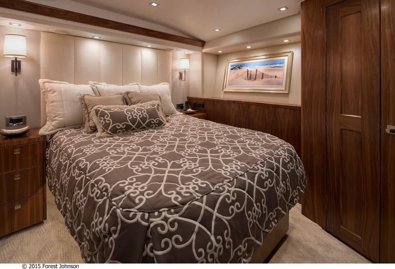 a bed with a pillow aboard 80'VIKING 2018 Yacht for Sale