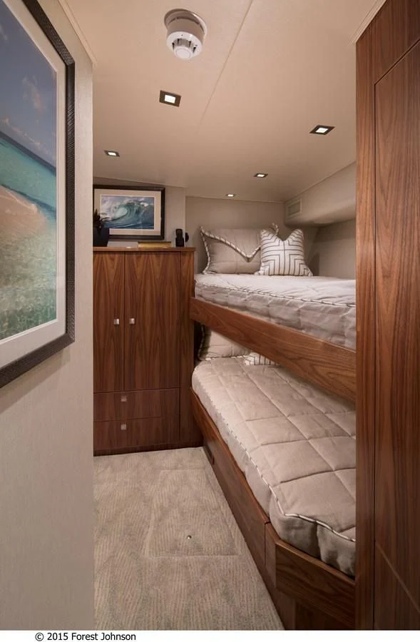 a bedroom with a bed and a television aboard 80'VIKING 2018 Yacht for Sale