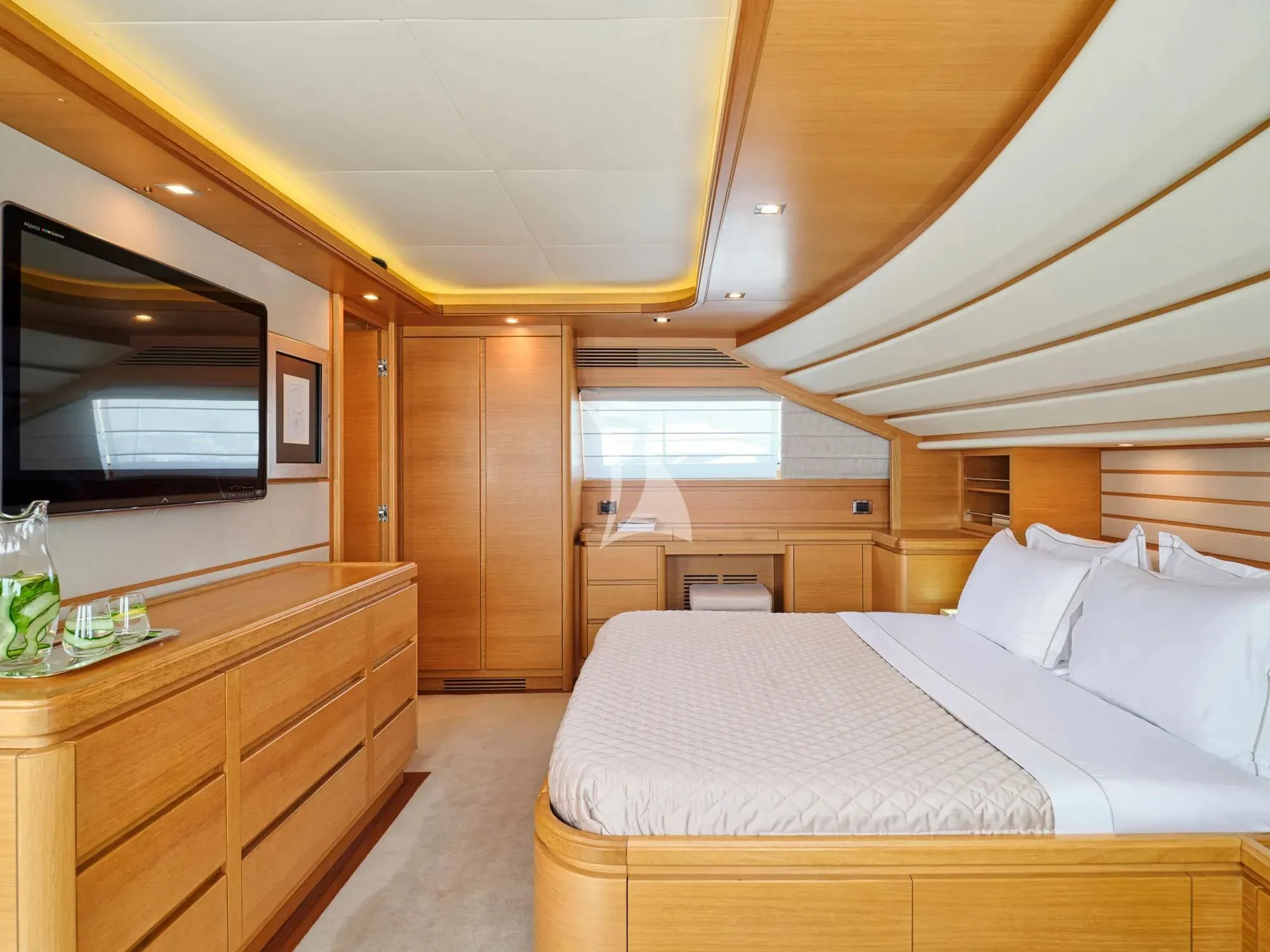 a bedroom with a bed and a tv aboard WATCH ME Yacht for Charter