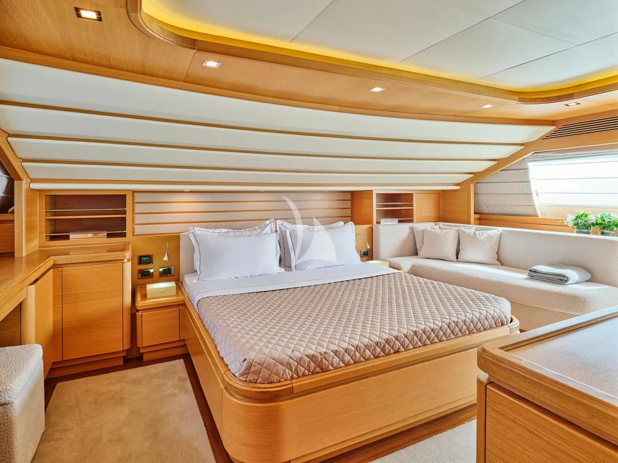 a room with a bed and a couch aboard WATCH ME Yacht for Charter