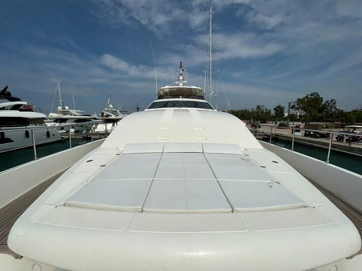 a large white boat in a harbor aboard WATCH ME Yacht for Charter