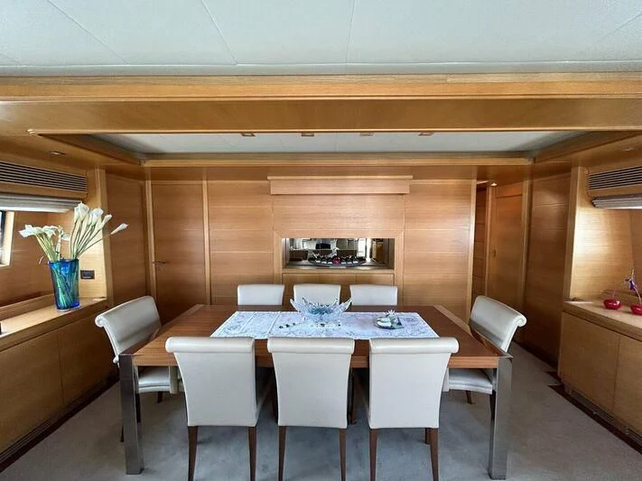 a dining table in a room aboard WATCH ME Yacht for Charter
