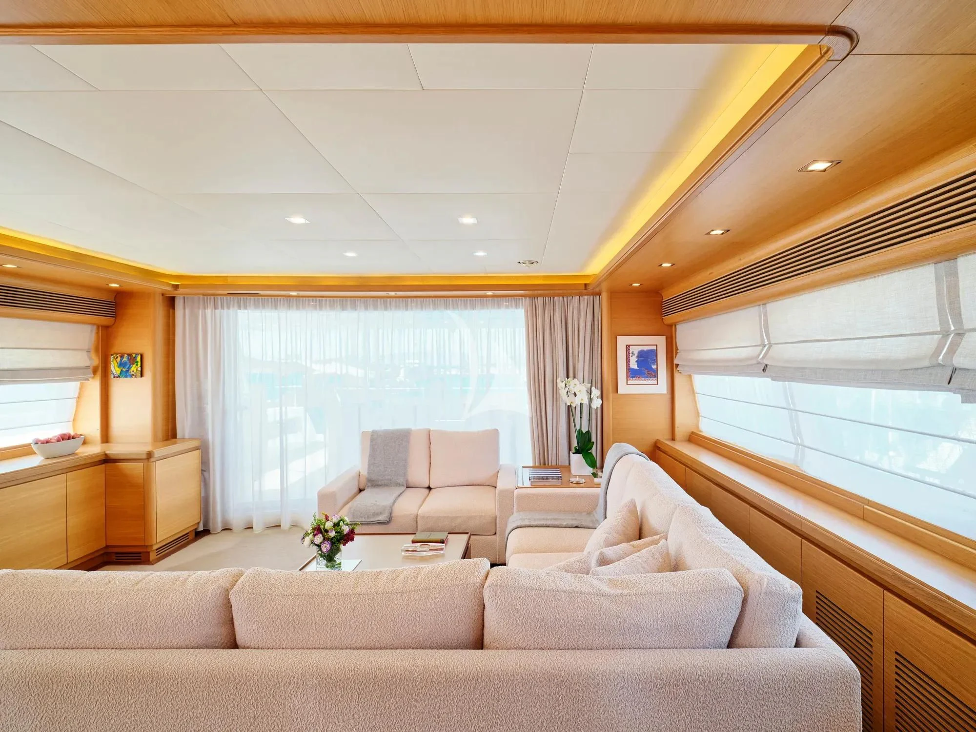 a living room with a couch and a window aboard WATCH ME Yacht for Charter