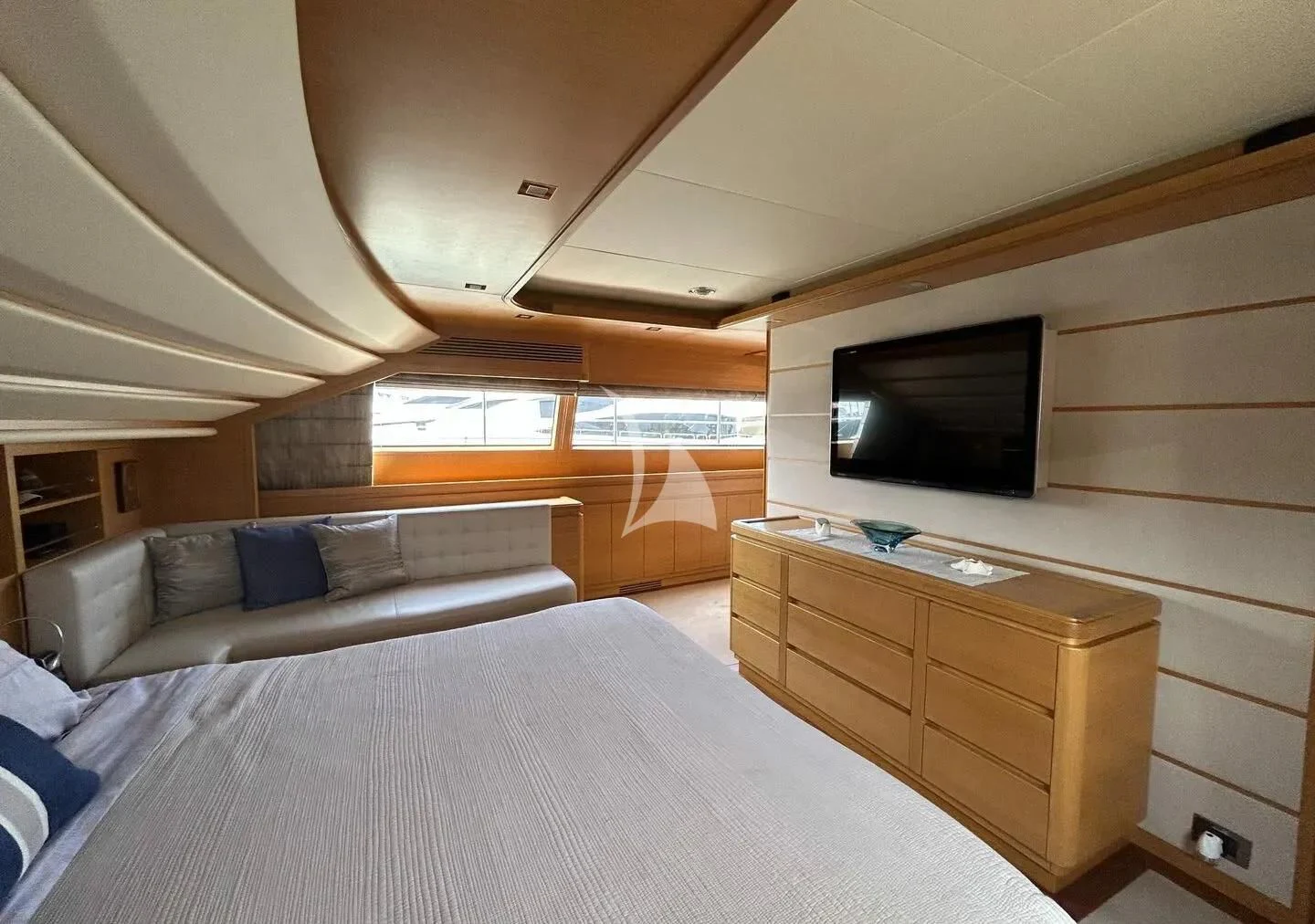 a bedroom with a bed and a tv aboard WATCH ME Yacht for Charter