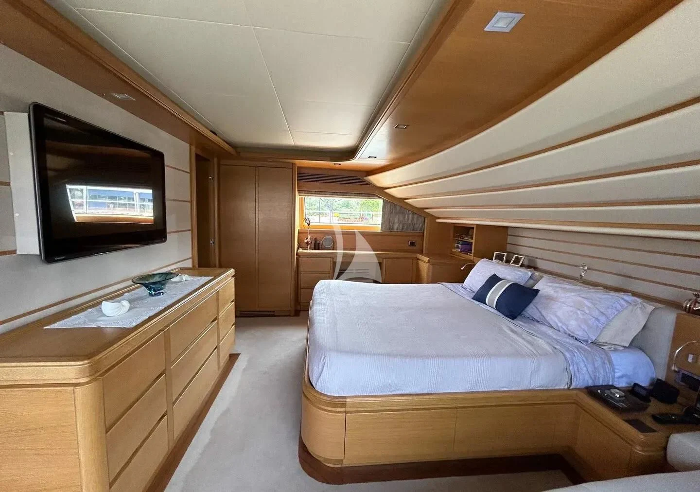 a bedroom with a bed and a tv aboard WATCH ME Yacht for Charter