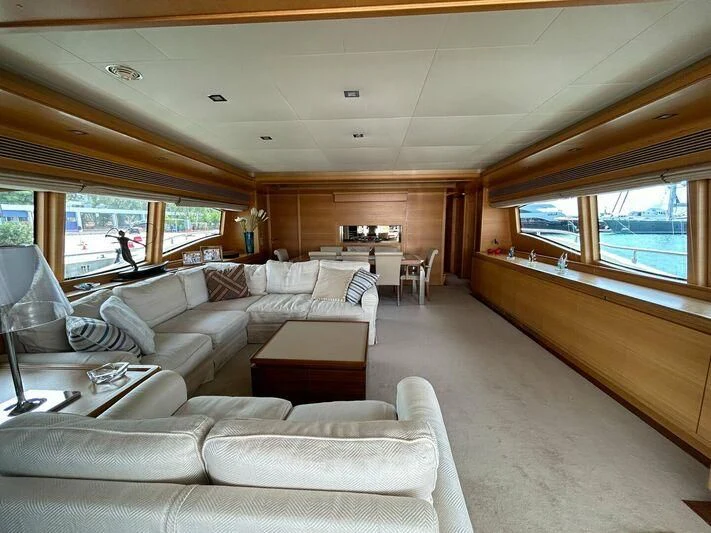 a living room with a large window aboard WATCH ME Yacht for Charter