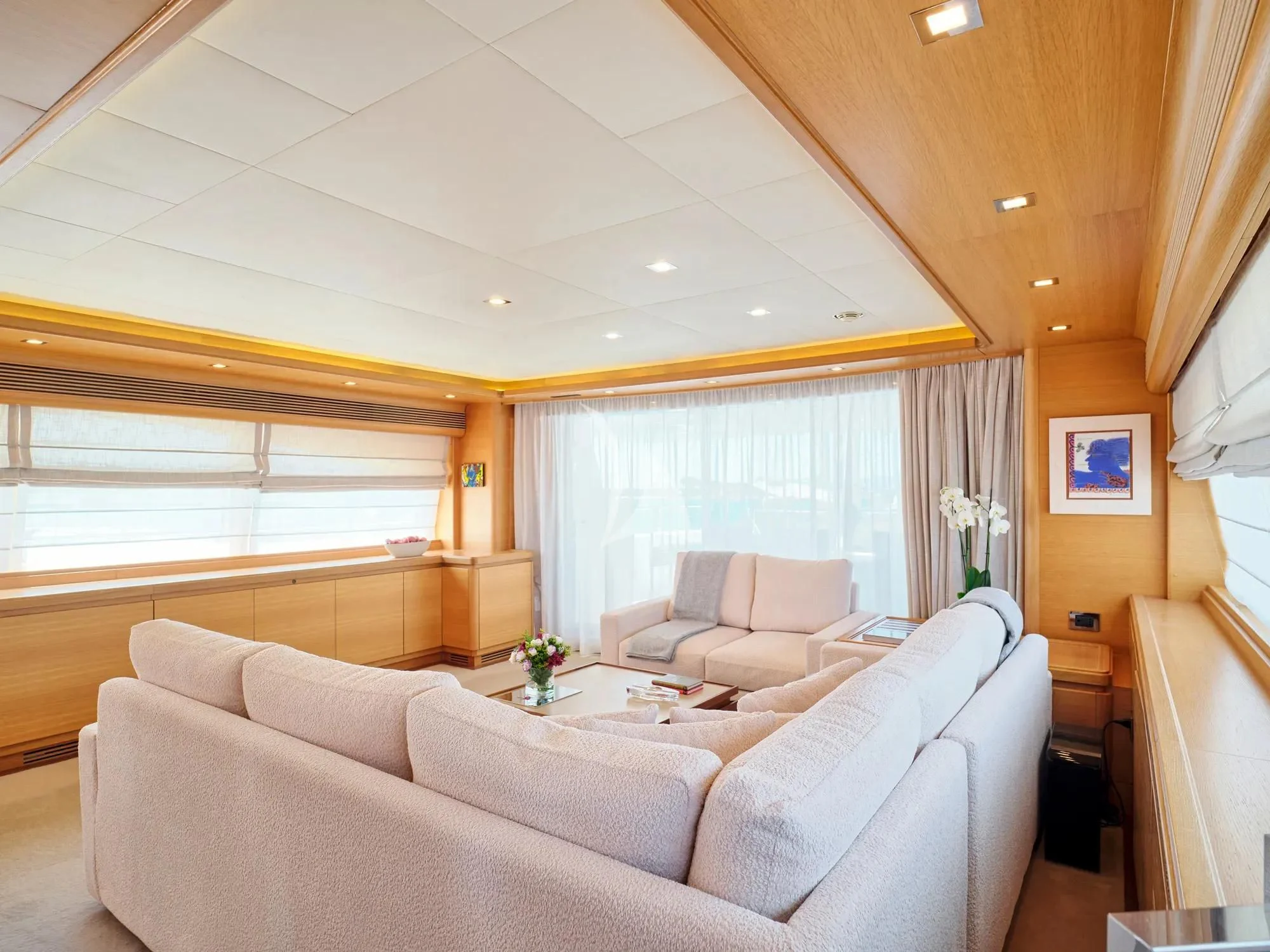 a living room with a couch and a table aboard WATCH ME Yacht for Charter
