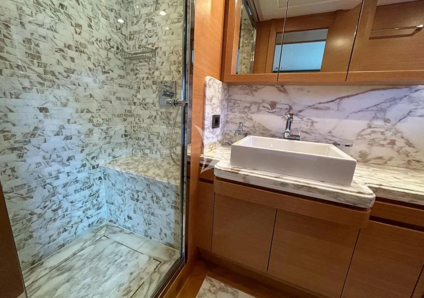 a bathroom with a tub sink and cabinets aboard WATCH ME Yacht for Charter