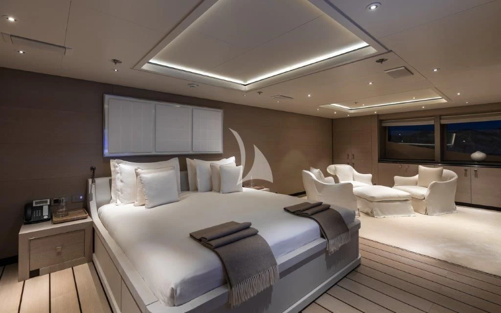 a room with a bed and a television aboard GRACE (YET) Yacht for Sale