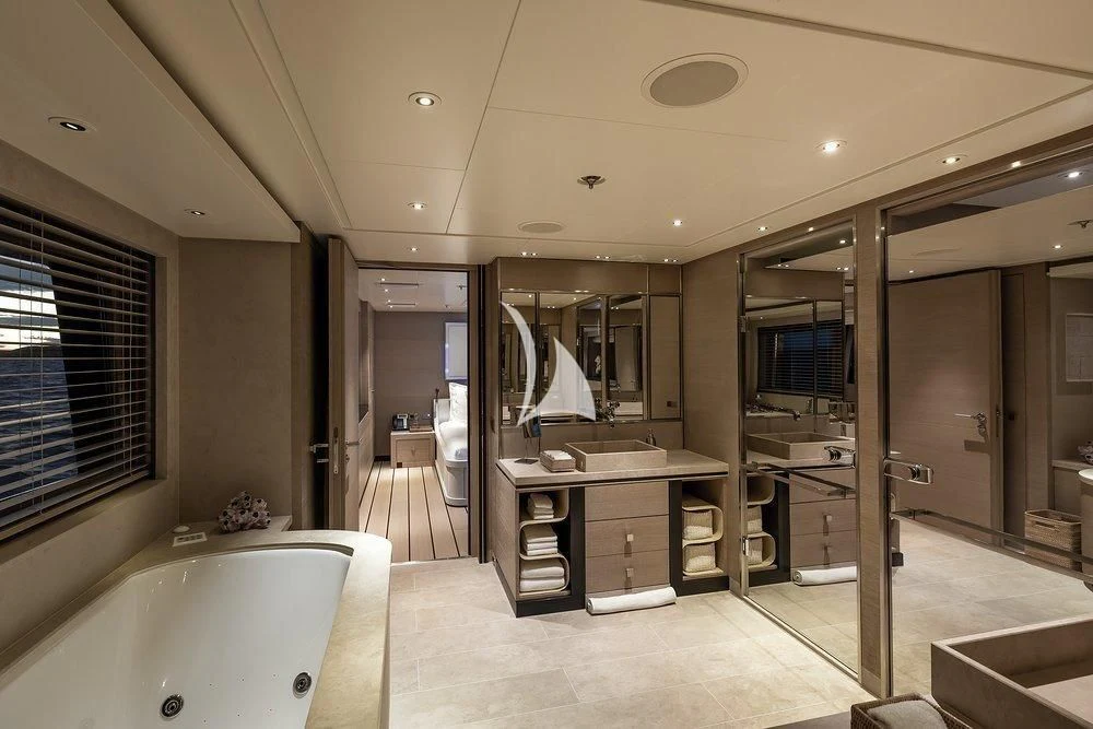 a bathroom with a tub sink and a sink aboard GRACE (YET) Yacht for Sale