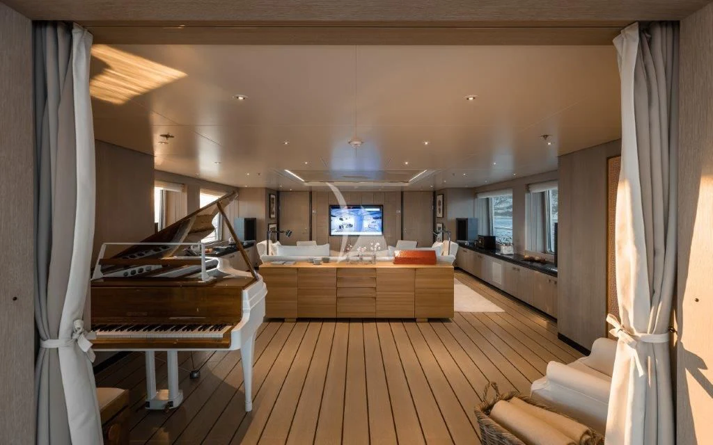 a room with a wood floor and a wood floor and a large window aboard GRACE (YET) Yacht for Sale
