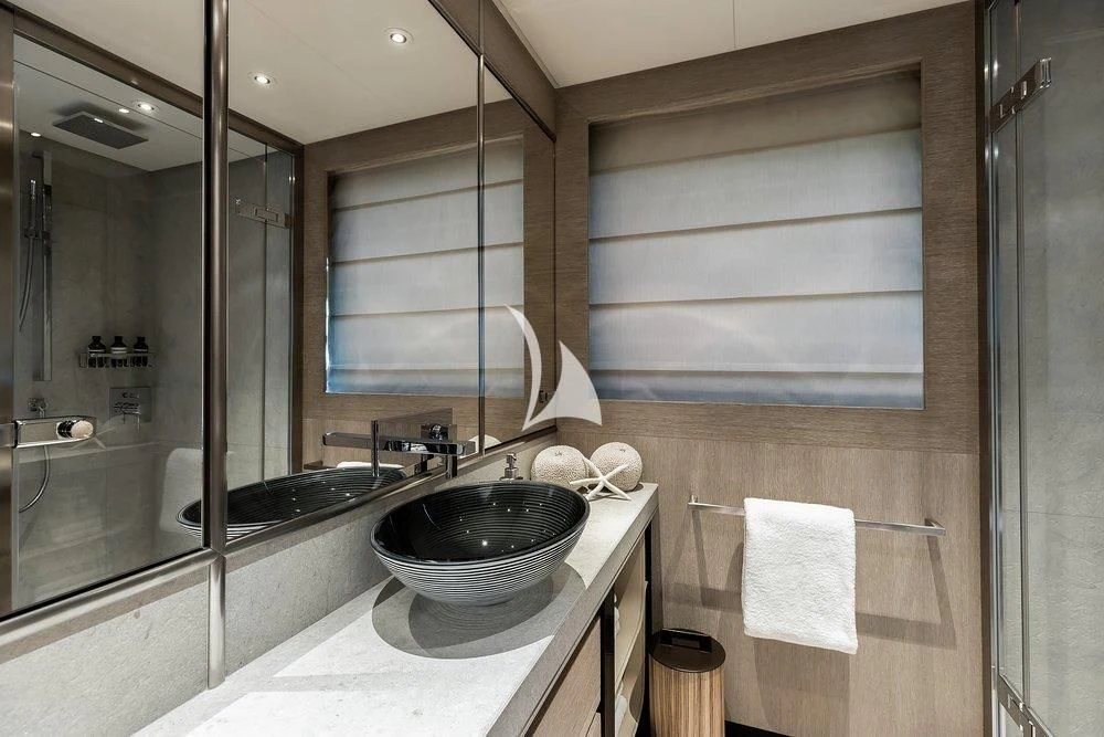 a bathroom with a sink and a mirror aboard GRACE (YET) Yacht for Sale