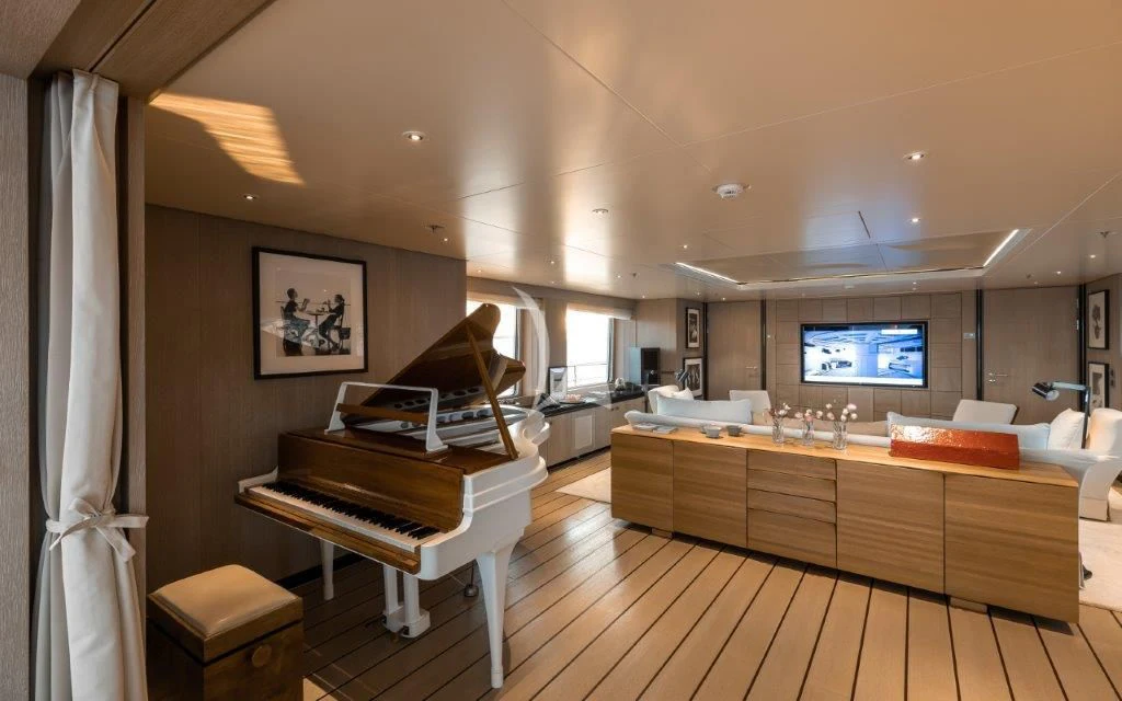 a room with a piano and a piano aboard GRACE (YET) Yacht for Sale