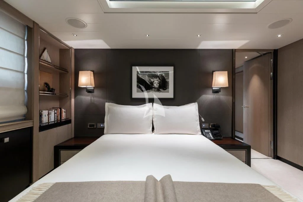 a bed with white sheets and pillows aboard GRACE (YET) Yacht for Sale
