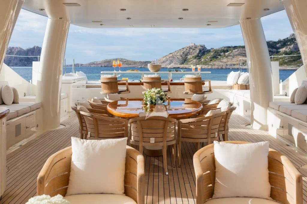 a room with a table and chairs aboard GRACE (YET) Yacht for Sale