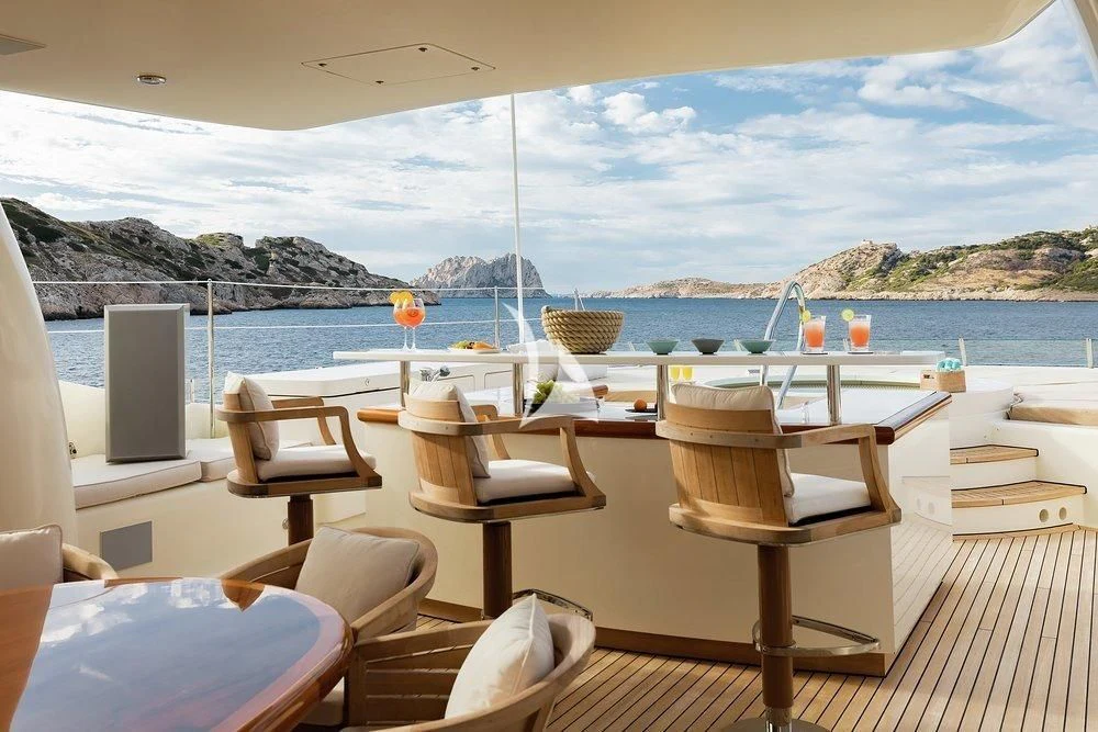 a room with chairs and a table aboard GRACE (YET) Yacht for Sale