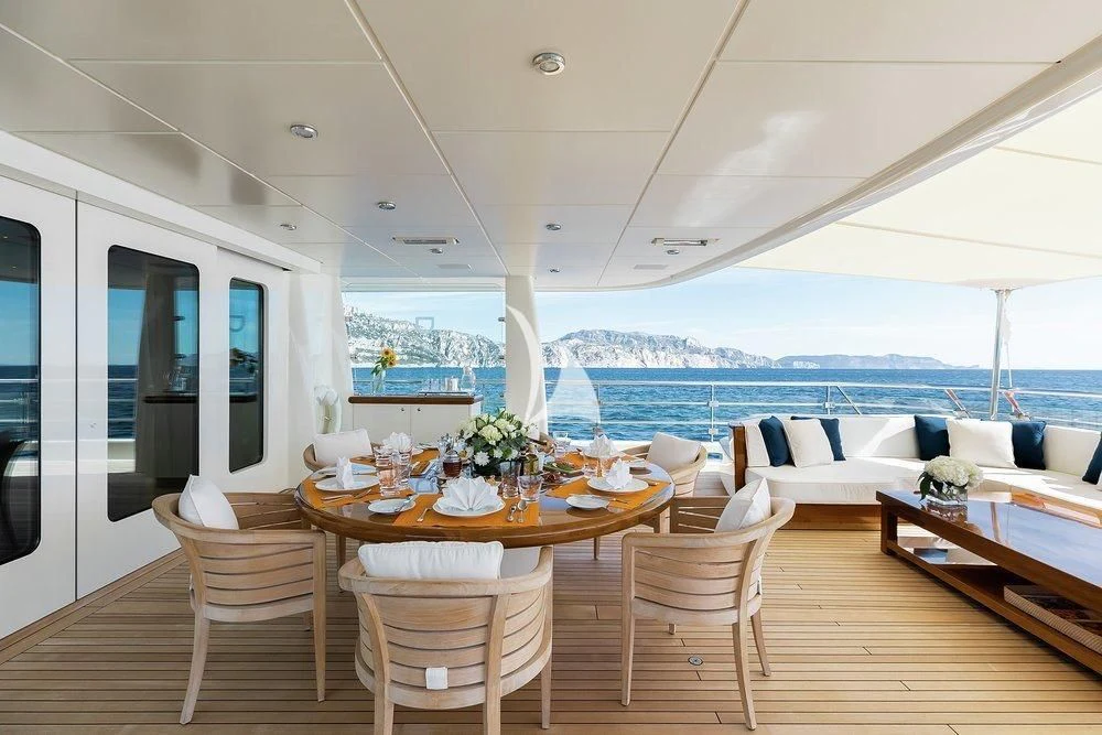 a room with a table and chairs aboard GRACE (YET) Yacht for Sale