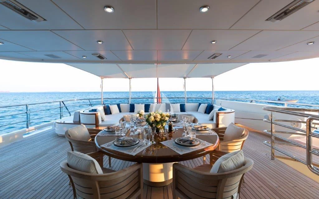 a room with a table and chairs aboard GRACE (YET) Yacht for Sale