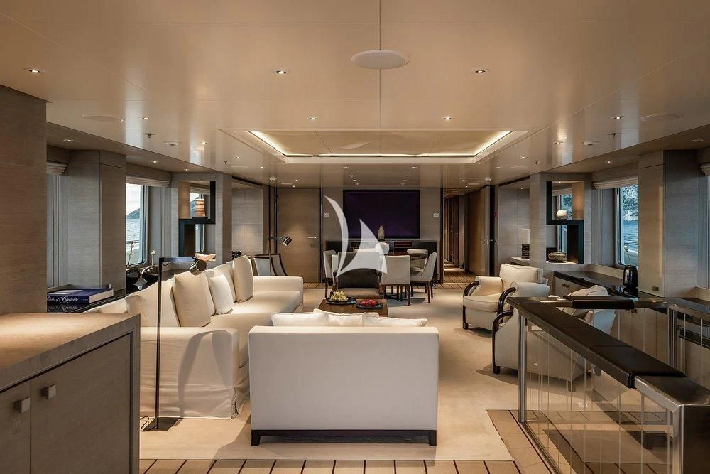 a living room with white furniture aboard GRACE (YET) Yacht for Sale