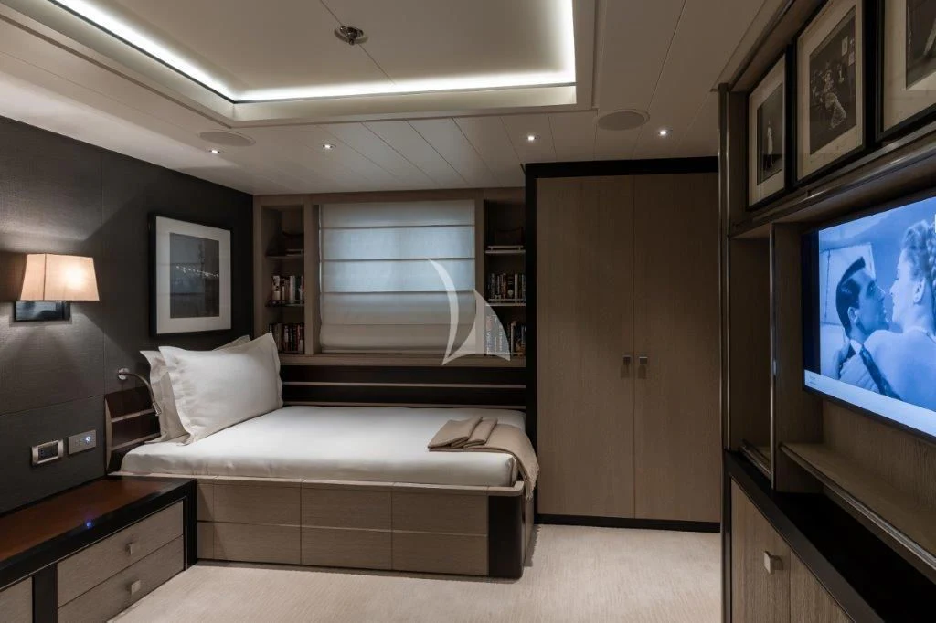 a bedroom with a bed and a tv aboard GRACE (YET) Yacht for Sale