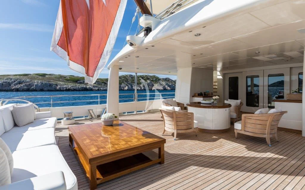 a large living room with a large patio and a pool aboard GRACE (YET) Yacht for Sale