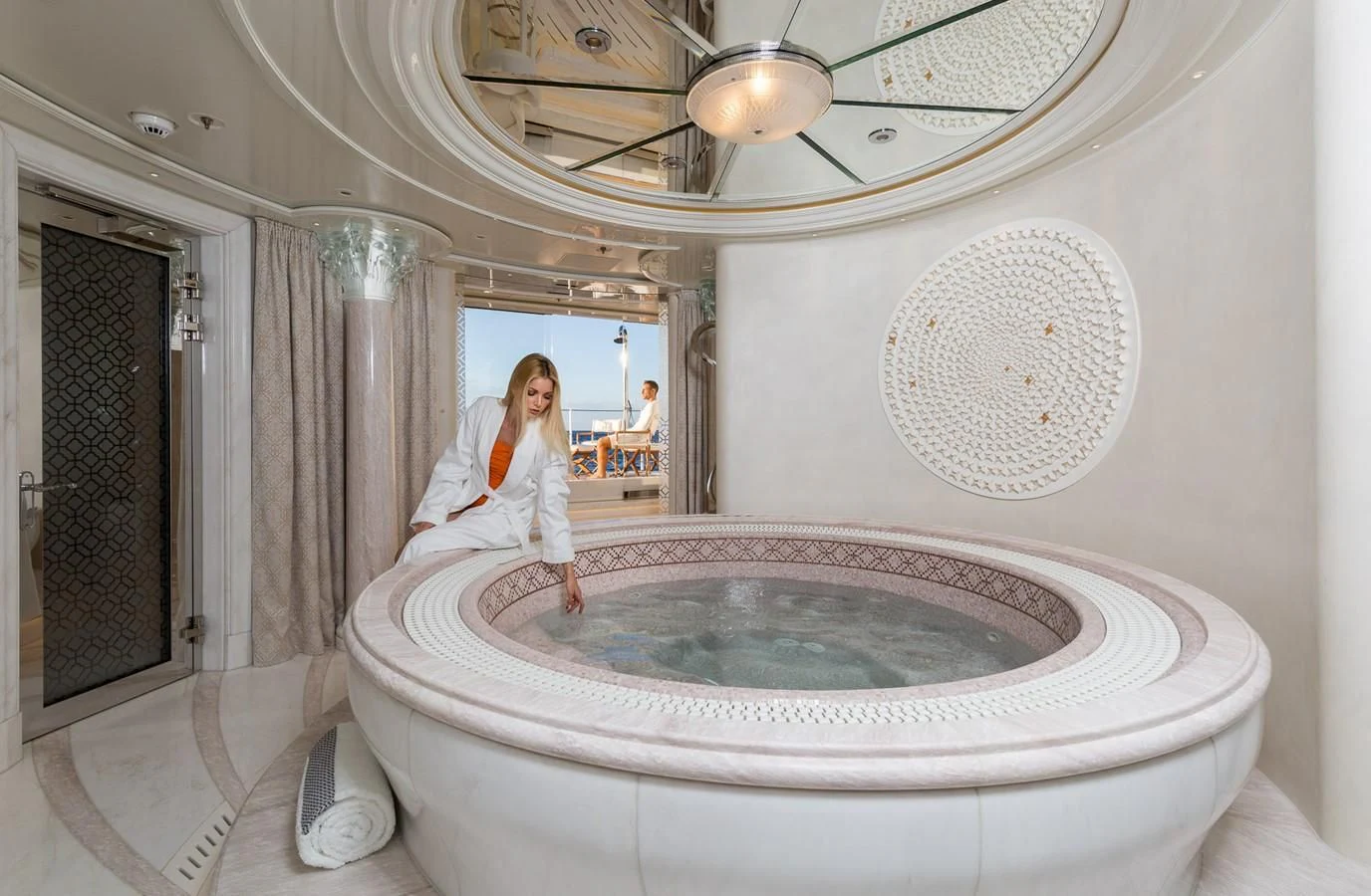 a person sitting on a bathtub aboard PLVS VLTRA Yacht for Sale