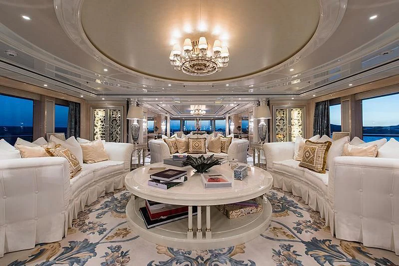 a large living room with a large chandelier aboard PLVS VLTRA Yacht for Sale
