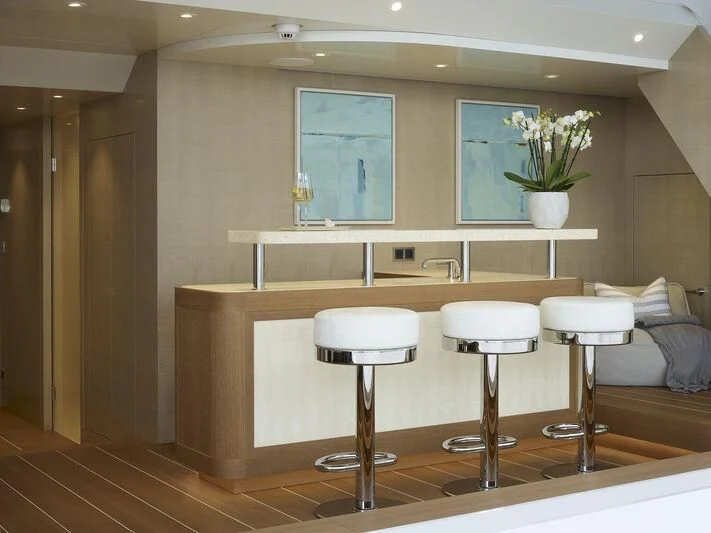 a room with stools and stools aboard PLVS VLTRA Yacht for Sale