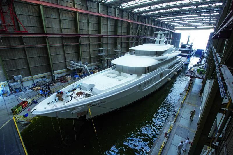 a large white boat in a large building aboard PLVS VLTRA Yacht for Sale