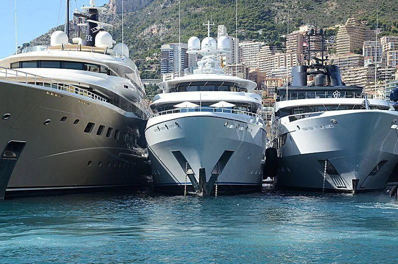 several boats in a harbor aboard PLVS VLTRA Yacht for Sale