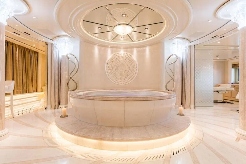 a large round circular object in a room with a tile floor aboard PLVS VLTRA Yacht for Sale