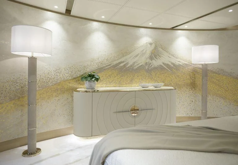 a white room with a white bed and a lamp aboard PLVS VLTRA Yacht for Sale