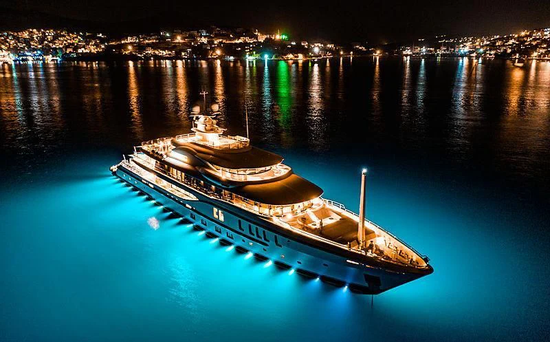 a city lit up at night aboard PLVS VLTRA Yacht for Sale