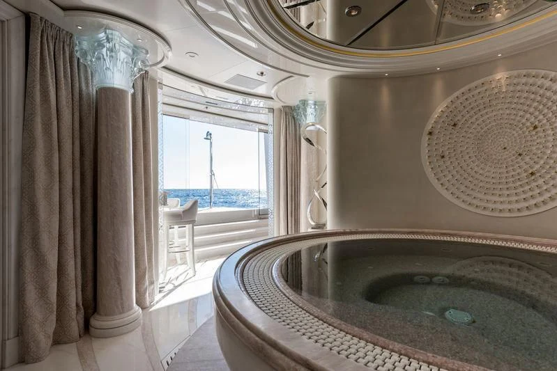 a bathroom with a tub and a sink aboard PLVS VLTRA Yacht for Sale