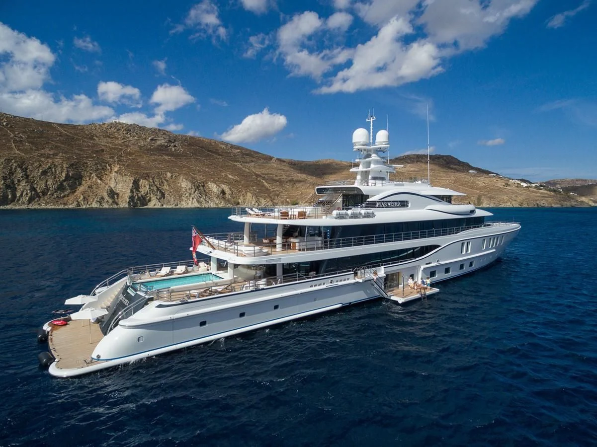 a large white boat in the water aboard PLVS VLTRA Yacht for Sale