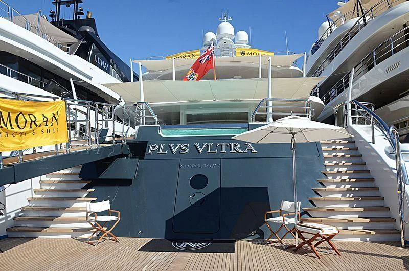 a boat with a flag on the deck aboard PLVS VLTRA Yacht for Sale